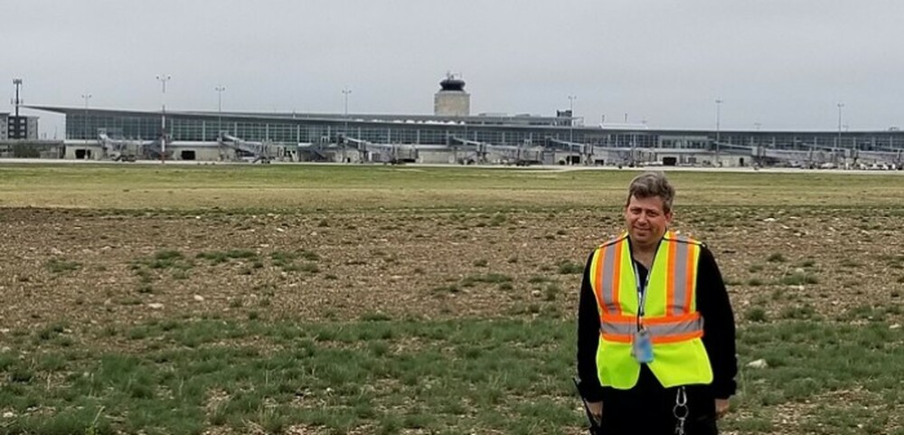 Shawn Trotman in front of the terminal on the airfield